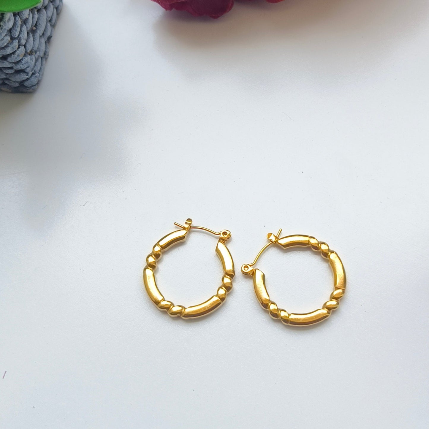 Discover timeless elegance with Melody Golden SS#22 Hoops Earrings. Crafted in 18K gold-plated stainless steel with cubic zirconia stones, these lightweight and versatile hoops add a touch of luxury to any outfit. Elevate your style today!